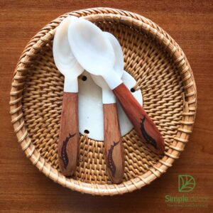 White mother-of-pearl and wooden spoon